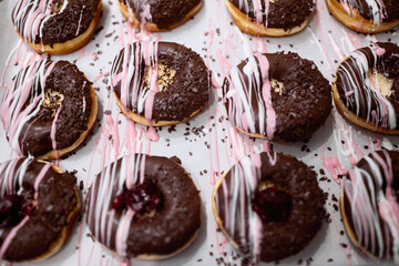 Closeup of sweet and delicious donuts ready for transport to pastry store. Pastry, dessert, sweet