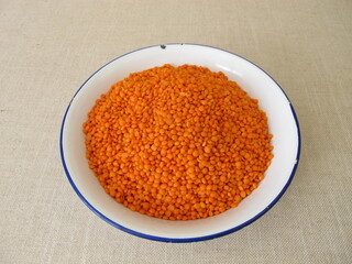 Hand bath with red lentils in a bowl