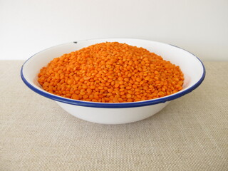 Hand bath with red lentils in a bowl
