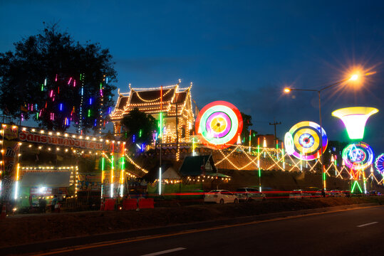 Photo of Night festival of Thai temple with colorful neon lamp on Tie the boundary in Ranong Province ,  Thailand.