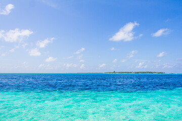 Azure water in the lagoon of the tropical island in the Maldives
