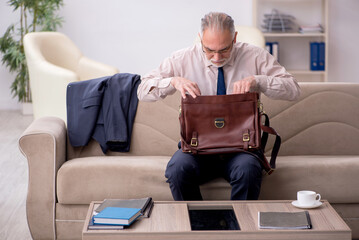 Old businessman employee waiting for business meeting