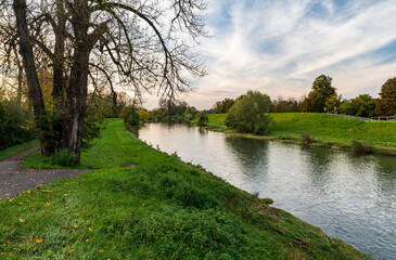 Olse river with trees and meadows around in Karvina city in Czech republic