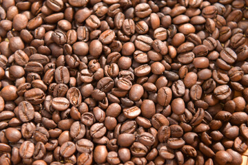Coffee composition.Coffee beans after roasting.Coffee beans and ground powder on stone background.selective focus