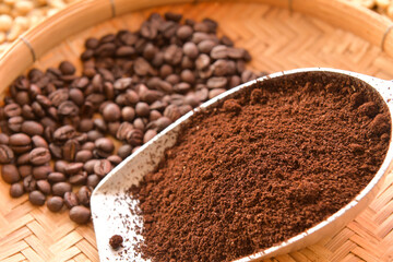 Coffee composition.Coffee beans after roasting.Coffee beans and ground powder on stone background.selective focus