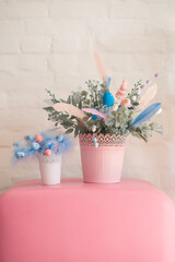 Easter served homemade table in the kitchen. Easster home decorations. pink and blue eggs