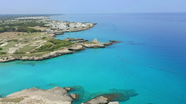 Aerial view, flight at Tower and bay of Roca Vecchia (Torre di Maradico), archaeological sites, Brindisi region, Apulia Italy