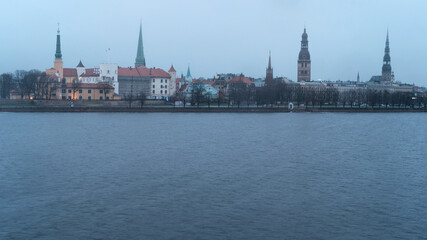 Obraz premium Dawn over Riga, snow falls in spring