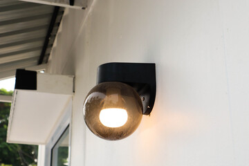 Beautiful lamp on white wall.