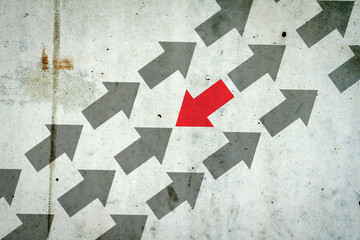 Arrows on a concrete wall. Red arrow, right direction. Leadership concept. Team. Business.