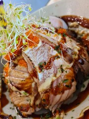 Close up of aburi salmon seared salmon don donburi salmon rice bowl at japanese restaurant with fish eggs 