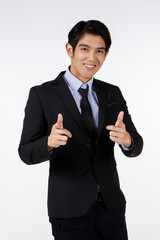 Portrait shot of Asian young friendly human resource officer in black formal suit standing smiling...
