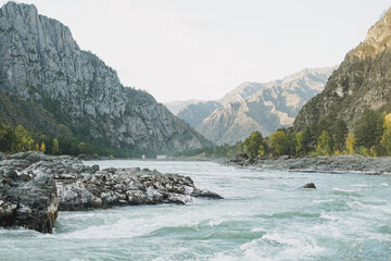 View of the turquoise river Katun and the Altai mountains, autumn season