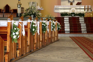 Interior of church decorated for Fisrt Holy Communion celebration, empty, without people