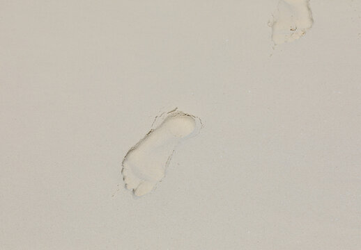 Footprint Of A Man On White Sand