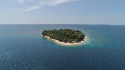 Tropical island with white sandy beach. Aerial view: Putipot island with colorful reef. Seascape, ocean and beautiful beach paradise. Philippines,Luzon. Travel concept.