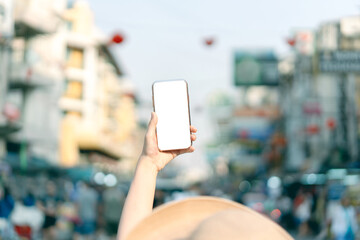 Mockup of smart phone blank white screen with traveller asian woman.