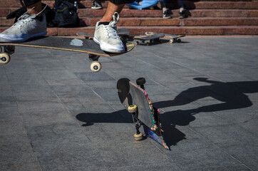 Youth jumping with a skateboard.