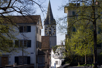 Old town of city of Zurich with medieval famous church Saint Peter. Photo taken April 21, 2021, Zurich, Switzerland.