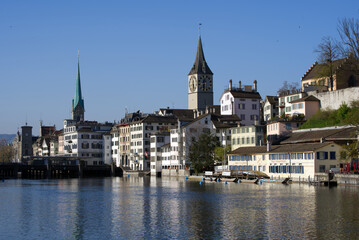 View over old town of Zurich with churches Fraumünster (German, translation is Women's Minster), and St. Peter. Photo taken April 21st, 2021, Zurich, Switzerland.