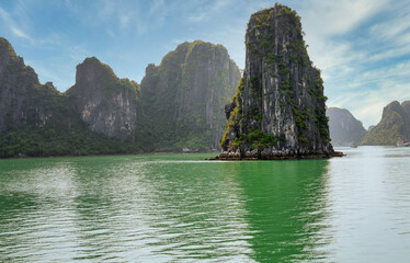 Fototapeta na wymiar Halong Bay Beautiful Natural Wonder. View of some of the 1,600 limestone island, that looks like something right out of a movie. UNESCO World Heritage Site since 1994 