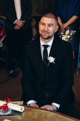 The groom is preparing to meet the bride. Portrait of a businessman.