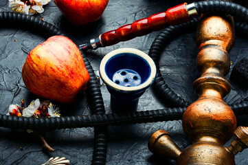 Smoking hookah with apple flavor