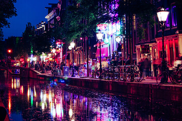 Amsterdam, The Netherlands, May 14 2018: Red lights on the canals of the Amsterdam red light district