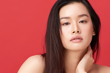 Naklejka premium Beautiful young asian woman with clean fresh skin on red background, Face care, Facial treatment, Cosmetology, beauty and spa, Asian women portrait