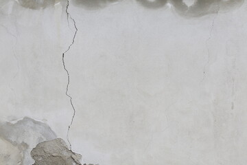 parete di cemento con intonaco crepato