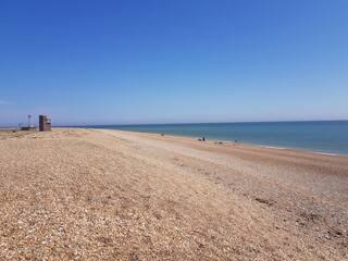 Pebble British beach. Pebble colorful coastline, horizontal. 