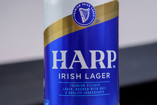 Tyumen, Russia-February 26, 2021: Beer Harp Irish Lager, Metal Can, Logo Close-up