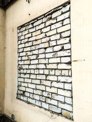The window is bricked into the wall as a background.