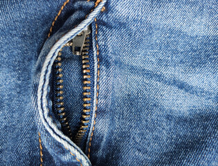 Denim zipper. Jeans blue, textile. View from above. place for text. Open zipper on jeans. Close-up, fashion concept. Empty space, place for text. Copy space. © Vero
