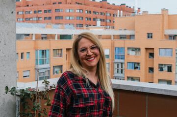 Young blonde girl smiling at the camera