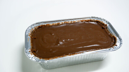 A chocolate soft cake in foil cup