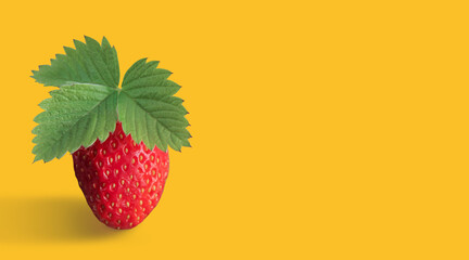 strawberry with leaf on a yellow isolated background