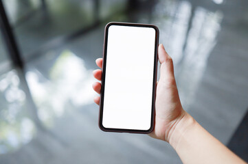 Women's hands holding cell telephone blank copy space screen. smart phone with technology concept