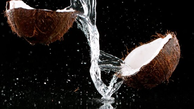 Super slow motion of falling cracked coconut