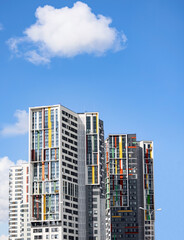 Modern residential apartment building on blue sky