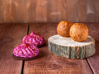 Set of homemade cakes, honey and nut balls and shortcakes with marshmallow and currant cream