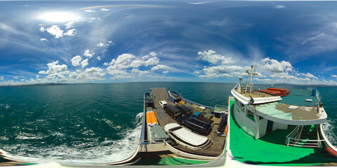 Passenger ferry at sea among tropical islands. Virtual Reality 360. Ferry service Lipata to San Ricardo, Philippines. 360 panorama VR.