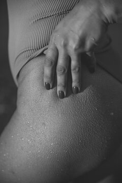 Close up photo of goosebumps on slim female buttocks