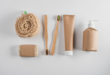 Set of loofah sponge, handmade soap, wooden toothbrushes, toothpaste and gel