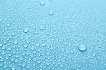Pure water drops texture or clear background. Blue abstract background. Fresh water droplets.