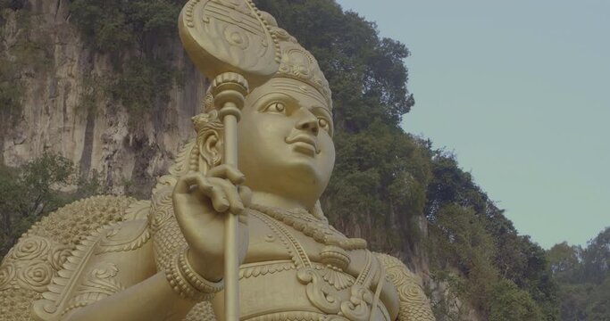 World's Tallest Statue of Murugan. Hindu God of War. Gold Statue in Batu Caves.