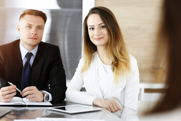 Fototapeta premium Business woman headshot in sunny office. Unknown businesswoman sitting behind computer monitor