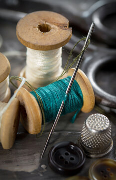 Threads, needles and sewing items.