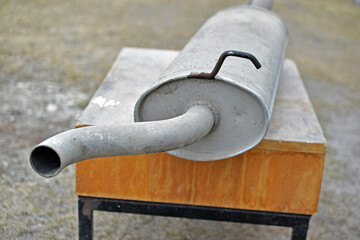 Iron car exhaust pipe under repair close-up