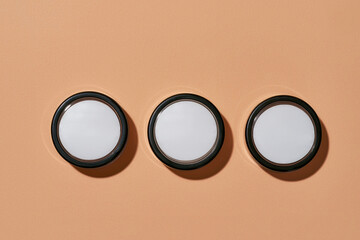 Set of round cans filled with cosmetological product